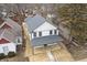 Aerial view of the home showcasing its roofline, siding, porch, and surrounding landscape at 4054 Boulevard Pl, Indianapolis, IN 46208