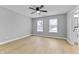This bedroom features natural light, hardwood floors, and a ceiling fan at 4054 Boulevard Pl, Indianapolis, IN 46208