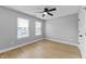 This bedroom features two windows for natural light and hardwood floors at 4054 Boulevard Pl, Indianapolis, IN 46208