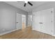 A spacious bedroom features hardwood floors, a ceiling fan, and closet at 4054 Boulevard Pl, Indianapolis, IN 46208
