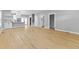 Open-concept living area with modern flooring, neutral walls, and a view of the kitchen at 4054 Boulevard Pl, Indianapolis, IN 46208