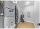A utility room with gray water heater, HVAC unit, and light wood-look flooring at 4054 Boulevard Pl, Indianapolis, IN 46208