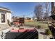 Outdoor patio with stylish seating, overhead string lights, and a peaceful view of the backyard at 4063 S Meadow Wood Ct, New Palestine, IN 46163