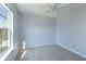 Bedroom featuring a ceiling fan and natural light from a nearby window at 4063 S Meadow Wood Ct, New Palestine, IN 46163