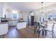 Spacious kitchen with stainless steel appliances, white cabinets, and a breakfast area filled with light at 4063 S Meadow Wood Ct, New Palestine, IN 46163