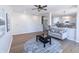 Spacious living room with hardwood floors, a ceiling fan, and a cozy gray sofa at 4063 S Meadow Wood Ct, New Palestine, IN 46163