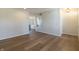 Bright living room featuring hardwood flooring, a staircase, and an open floor plan at 4063 S Meadow Wood Ct, New Palestine, IN 46163