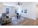Upstairs sitting room featuring hardwood floors, comfortable seating and bright, natural light at 4063 S Meadow Wood Ct, New Palestine, IN 46163