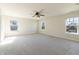 Bright main bedroom features plush carpeting, large windows, and ample space at 4063 S Meadow Wood Ct, New Palestine, IN 46163
