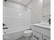 Bathroom features a shower-tub combo and a single sink vanity with gray-toned flooring at 4180 Douro Trl, Westfield, IN 46062