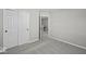 Bedroom with neutral carpet and closet with double doors is located near the stairwell at 4180 Douro Trl, Westfield, IN 46062