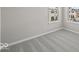 Neutral carpet in a bedroom that has two windows overlooking the exterior at 4180 Douro Trl, Westfield, IN 46062