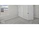 Neutral bedroom with a large window allowing for lots of natural light and double closet doors at 4180 Douro Trl, Westfield, IN 46062