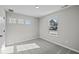 Bedroom with neutral carpet and windows overlooking the exterior of the home at 4180 Douro Trl, Westfield, IN 46062