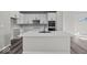 Contemporary kitchen with a spacious island, sleek countertops, modern appliances, and an open layout for cooking and entertaining at 4180 Douro Trl, Westfield, IN 46062