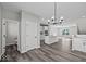 Open-concept living space featuring hardwood floors, neutral walls, modern lighting, and an efficient layout for seamless living at 4180 Douro Trl, Westfield, IN 46062