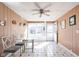 Sunlit dining area with a glass table, four chairs, and neutral tones at 4808 N Tuxedo St, Indianapolis, IN 46205