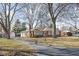 Charming single-story brick home with a large front yard and a long driveway at 4808 N Tuxedo St, Indianapolis, IN 46205
