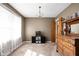 Bright living room featuring a large window and vintage furniture, offering a cozy and inviting space at 4808 N Tuxedo St, Indianapolis, IN 46205