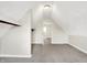 Bright attic featuring carpet, storage shelves, and natural light at 523 Terrace Ave, Indianapolis, IN 46203