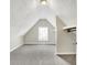Attic space with carpet, shelves, a window and natural light at 523 Terrace Ave, Indianapolis, IN 46203