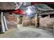 Unfinished basement area displaying open layout and brick foundation at 523 Terrace Ave, Indianapolis, IN 46203