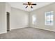 This carpeted bedroom features two windows for plenty of natural light at 523 Terrace Ave, Indianapolis, IN 46203