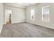 Bedroom featuring carpet, natural light, and view to the bathroom at 523 Terrace Ave, Indianapolis, IN 46203