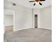 Bedroom with carpet, ceiling fan, walk-in closet and view into another room at 523 Terrace Ave, Indianapolis, IN 46203