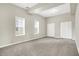 Bedroom featuring carpet, natural light from the windows, and double closets at 523 Terrace Ave, Indianapolis, IN 46203