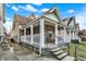 Inviting front porch with white railing and steps leading to the entrance at 523 Terrace Ave, Indianapolis, IN 46203