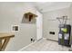 Functional laundry room with utility sink and tile floor at 523 Terrace Ave, Indianapolis, IN 46203