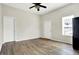 The living room features updated wood-look floors, neutral paint, and two doors at 523 Terrace Ave, Indianapolis, IN 46203