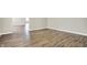 Spacious living room showcasing wood-look floors and neutral wall colors at 523 Terrace Ave, Indianapolis, IN 46203