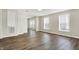 Bright living area showcasing wood-look floors and neutral paint, with bright windows at 523 Terrace Ave, Indianapolis, IN 46203