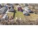 The aerial view captures the property's large backyard, the red fence, and the surrounding residential neighborhood at 5334 E Burgess Ave, Indianapolis, IN 46219