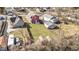 Discover this property from above, showcasing the large backyard, vibrant red fence, and quiet neighborhood setting at 5334 E Burgess Ave, Indianapolis, IN 46219
