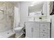 Bathroom featuring white vanity and walk-in shower at 5334 E Burgess Ave, Indianapolis, IN 46219