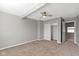 Bedroom features neutral walls, carpeting, ceiling fan and a closet for storage at 5334 E Burgess Ave, Indianapolis, IN 46219