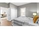 Bedroom features hardwood floors, neutral paint and closet at 5334 E Burgess Ave, Indianapolis, IN 46219