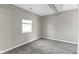 Neutral bedroom with a window offering natural light and plush carpeting at 5334 E Burgess Ave, Indianapolis, IN 46219