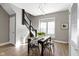 Dining room features a staircase and view to living area at 5334 E Burgess Ave, Indianapolis, IN 46219