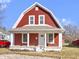 Front view of a charming two-story home featuring a welcoming porch, classic design and clean finishes at 5334 E Burgess Ave, Indianapolis, IN 46219