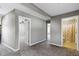 Neutral hallway with access to various rooms, including a bathroom and bedroom at 5334 E Burgess Ave, Indianapolis, IN 46219
