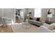 Beautifully staged living room with neutral colors, modern decor, and hardwood floors at 5334 E Burgess Ave, Indianapolis, IN 46219