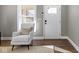 View from entry showing freshly painted living room with hardwood floors and lots of natural light at 5334 E Burgess Ave, Indianapolis, IN 46219