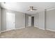 Large main bedroom with multiple doors, plush carpet and neutral paint at 5334 E Burgess Ave, Indianapolis, IN 46219