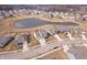 Aerial view of a neighborhood with a pond at 5646 Mahogany Dr, Noblesville, IN 46062
