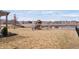 Large backyard with a playset, pergola, lake, and black fence at 5646 Mahogany Dr, Noblesville, IN 46062