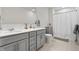 Bathroom featuring double sinks, neutral tones, and shower and bath at 5646 Mahogany Dr, Noblesville, IN 46062